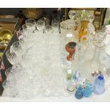 Various glassware including a part-suite of drinking glasses, four decanters, a frosted glass ice