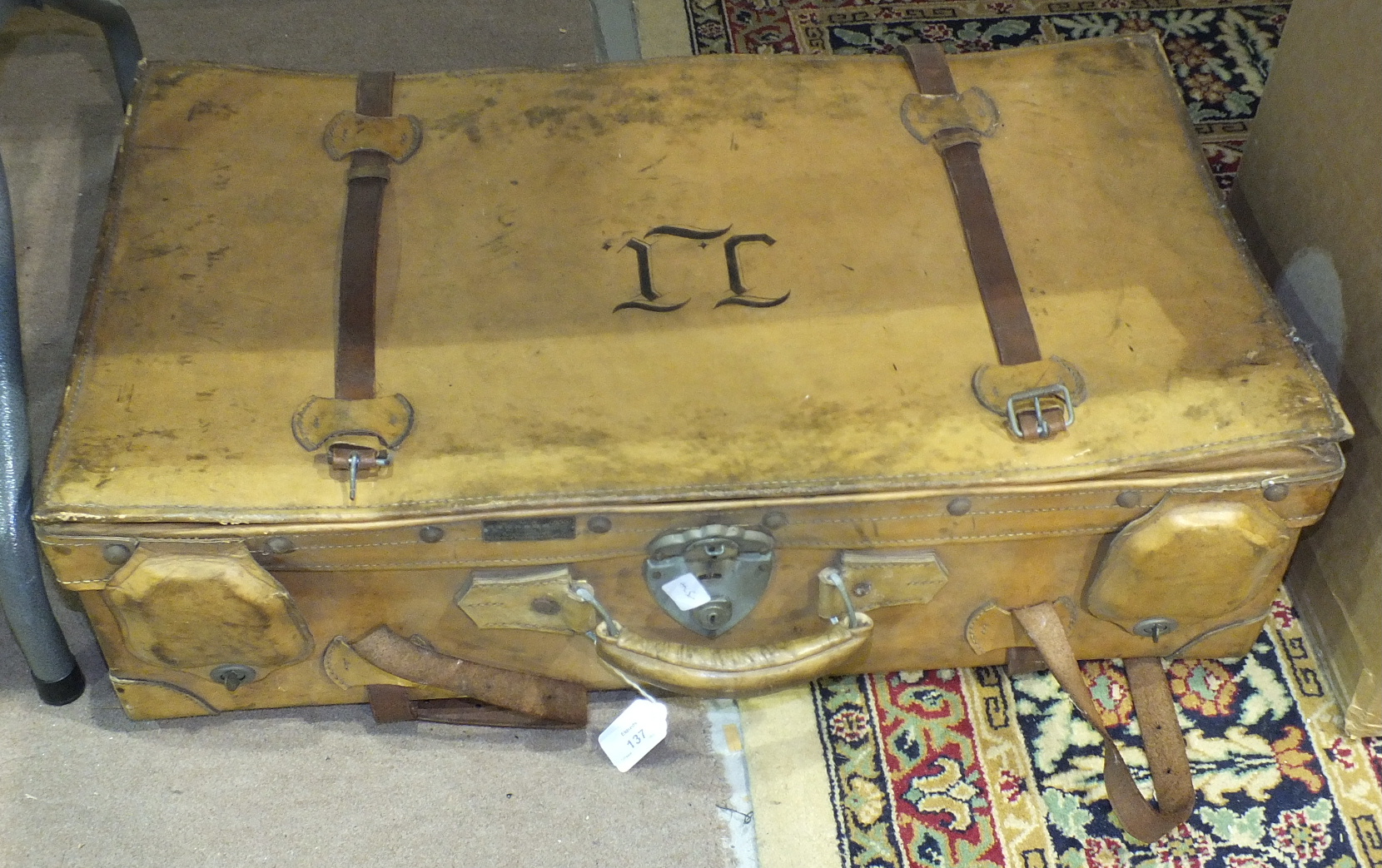 A vintage leather suitcase by Nam Ha Leather Factory, Hong Kong, Shanghai, 76 x 42cm, 20cm high.