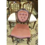A pair of late Victorian walnut bedroom chairs with upholstered seats, and a late Victorian