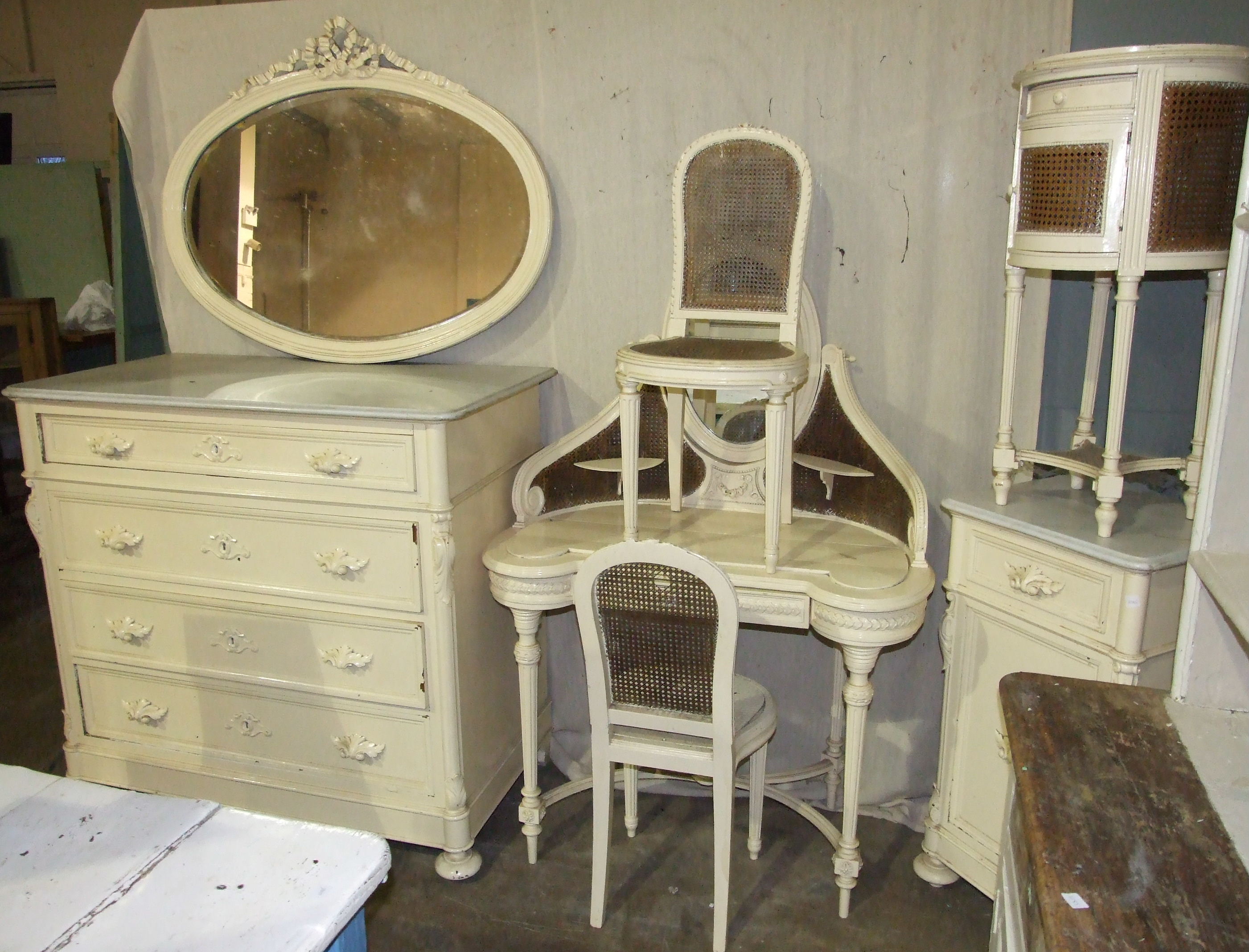 A 19th century Continental painted wood dressing table with double caned panels, drawer and