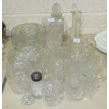 A collection of glassware, including decanters, jugs, drinking glasses, etc.