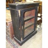 A 19th century ebonised display cabinet, 76cm wide and a 19th century pedestal writing desk, both in