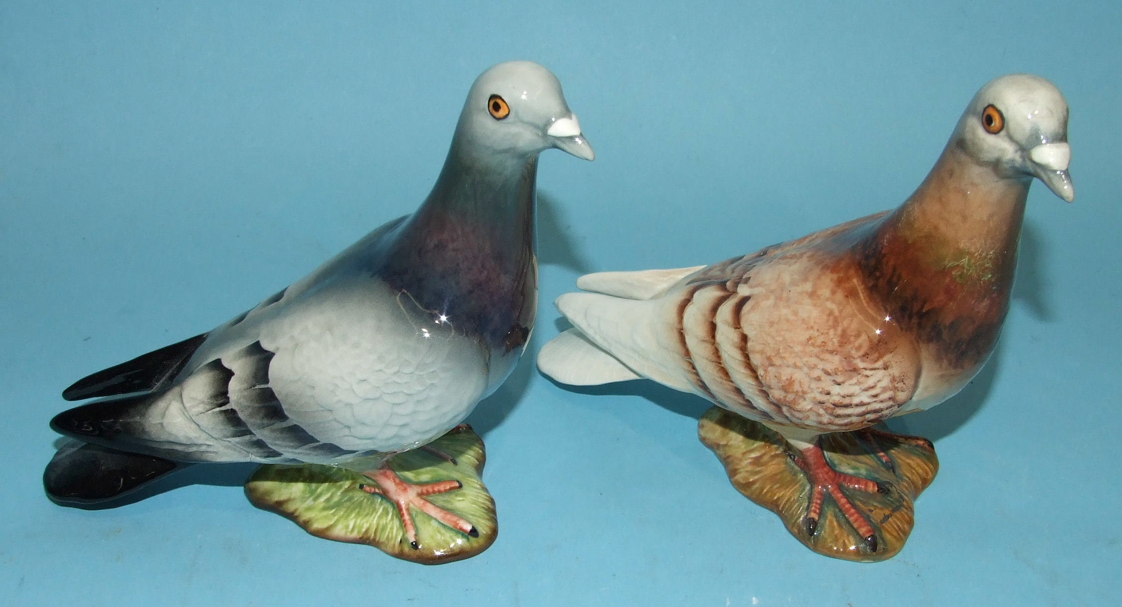 A Beswick model of a Wood Pigeon, no.1383, with label, 14cm high and another in pale brown