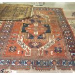 An Eastern rug decorated with figures, animals and geometric shapes, 245 x 192cm and one other