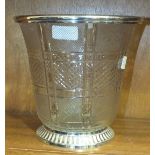 A modern cut-glass ice bucket of slightly-flared shape, with silvered metal mounts, 21cm high.