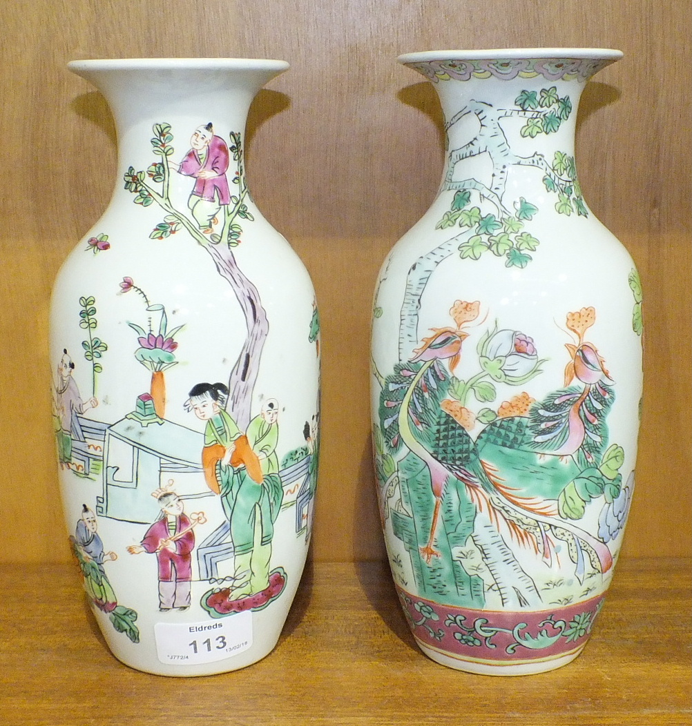 A pair of 20th century Oriental famille rose baluster vases, 24cm high, (2).