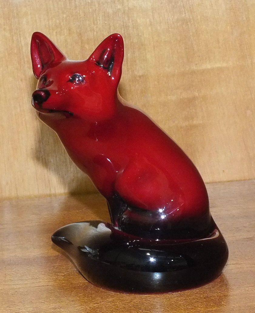 A Royal Doulton flambé-glazed model of a Fox, 11cm high.