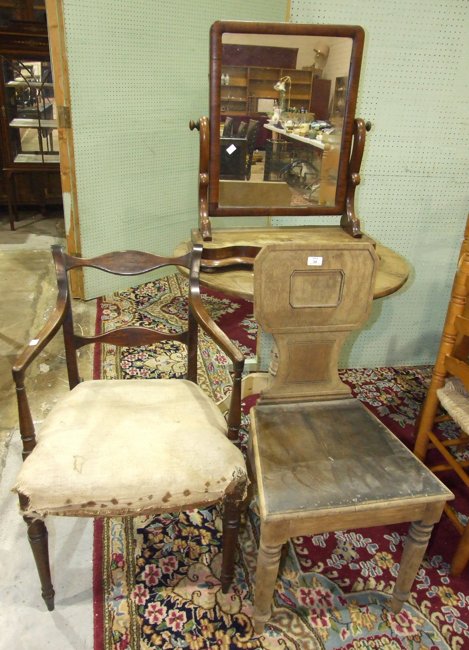 An elm circular tilt-top table on painted tripod, a stripped oak hall chair and other items, all