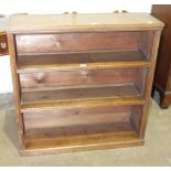 A walnut freestanding open bookcase, 91cm wide, 93cm high, 30cm deep.