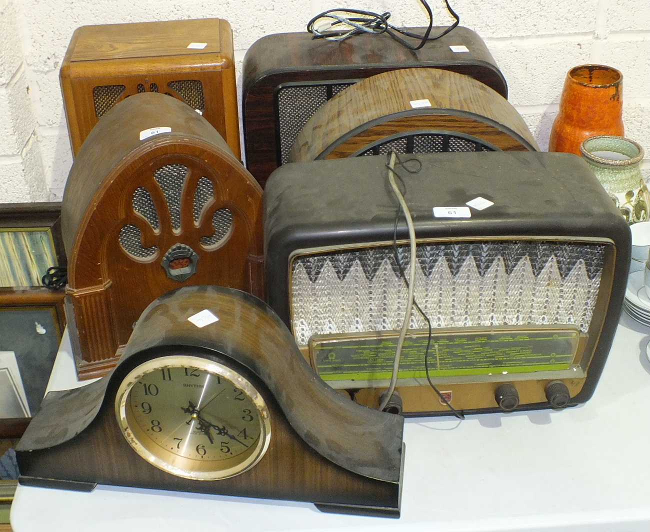 A Philips Type341A Bakelite mains radio, four reproduction radios and a mantel clock, (6).