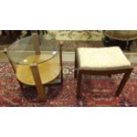 A 1950's/60's oak circular occasional table with plate glass top, the supports joined by an