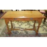 A modern stained pine hall table, the rectangular top above two frieze drawers, on turned legs