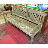 A teak garden bench (a/f), 160cm wide.