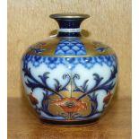 A Moorcroft Macintyre Aurelian Ware vase of squat baluster form, decorated in blue, red and gilt