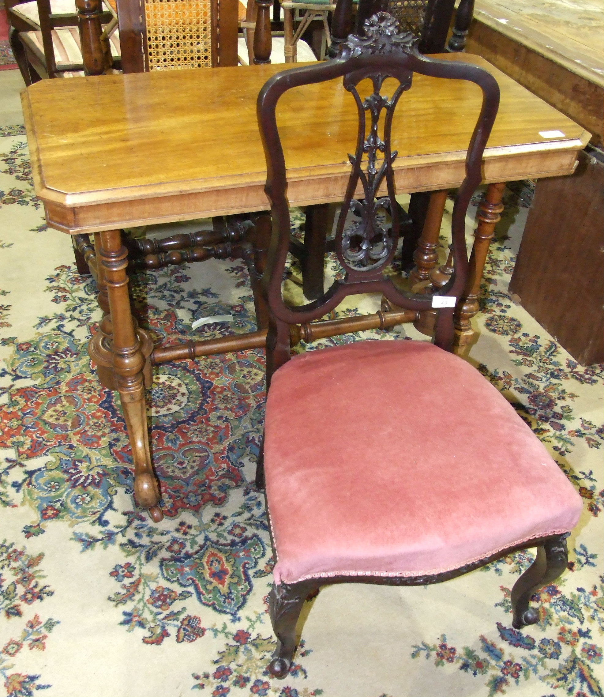 A Victorian walnut hall table, (in need of restoration) and an Edwardian stained wood nursing chair.