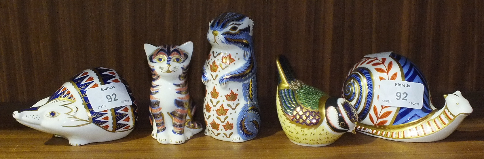A collection of five Royal Crown Derby paperweights, 'Blue Tit' gold stopper, 'Chipmunk' silver