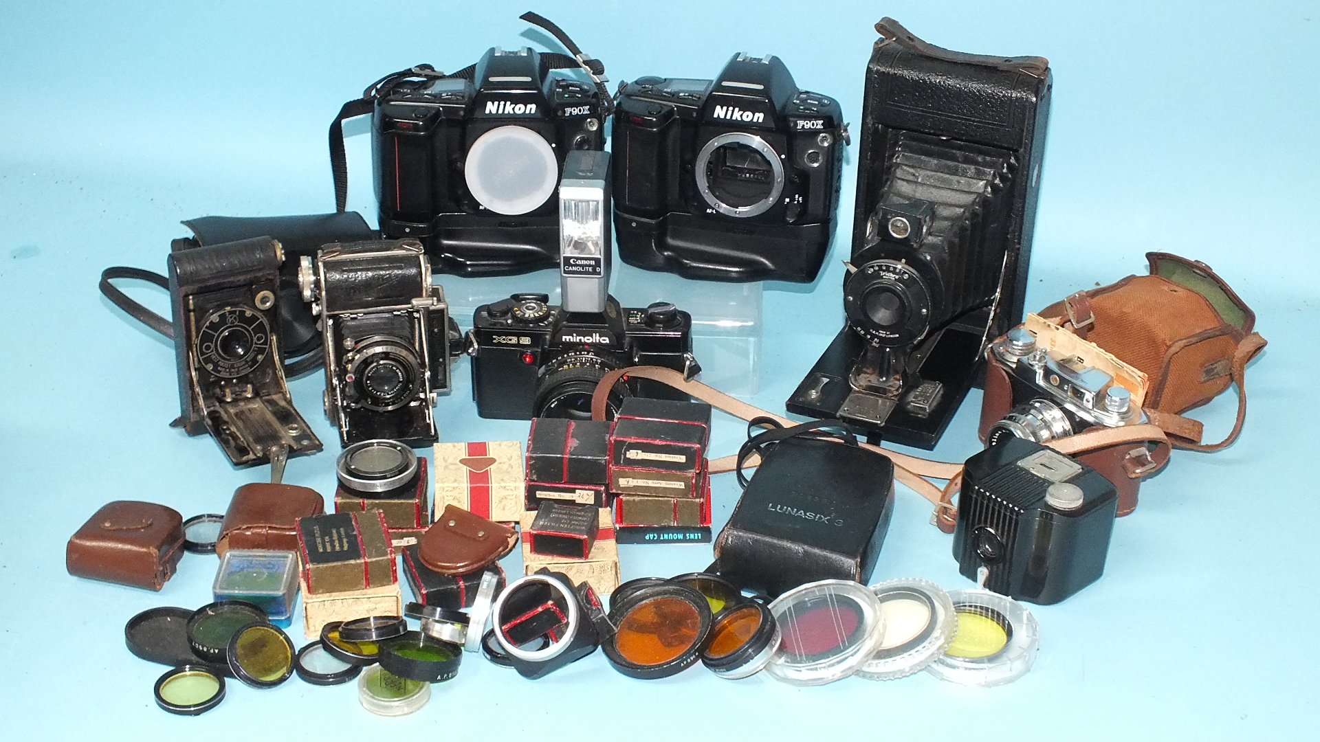 A quantity of cameras to include: Minolta XG9, Nikon F90x (x2), Halina 35X, Super Baldina and