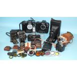 A quantity of cameras to include: Minolta XG9, Nikon F90x (x2), Halina 35X, Super Baldina and