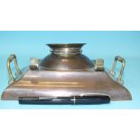 A WWI trench art inkstand in copper, with brass and copper lid, in the form of an officer's cap,