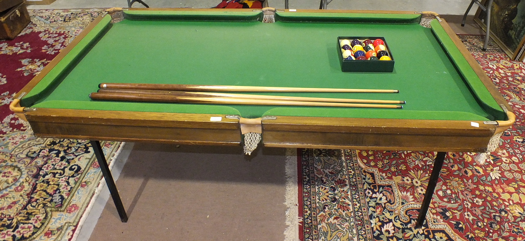 A half-size slate bed snooker/billiards table, 191 x 100cm overall, together with cues and balls.