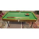 A half-size slate bed snooker/billiards table, 191 x 100cm overall, together with cues and balls.
