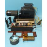 A magic lantern, cased and a quantity of magic lantern colour slides of gardens, flowers and