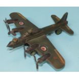 A scratch-built metal model of a WWII RAF bomber with four engines and machine gun turrets, 28cm