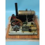 A large live steam horizontal stationary engine with 17cm diameter fly wheel, base 50cm square,