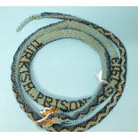 A WWI Turkish Prisoner of War beaded snake dated 1913, (a/f), 170cm long.