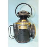 A Japanned LSWR four-aspect hand lamp with brass label and detail, stamped 'Tower Hill' on the side,