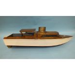 A scratch built live steam model of a boat, of wooden construction with brass boiler and funnel,