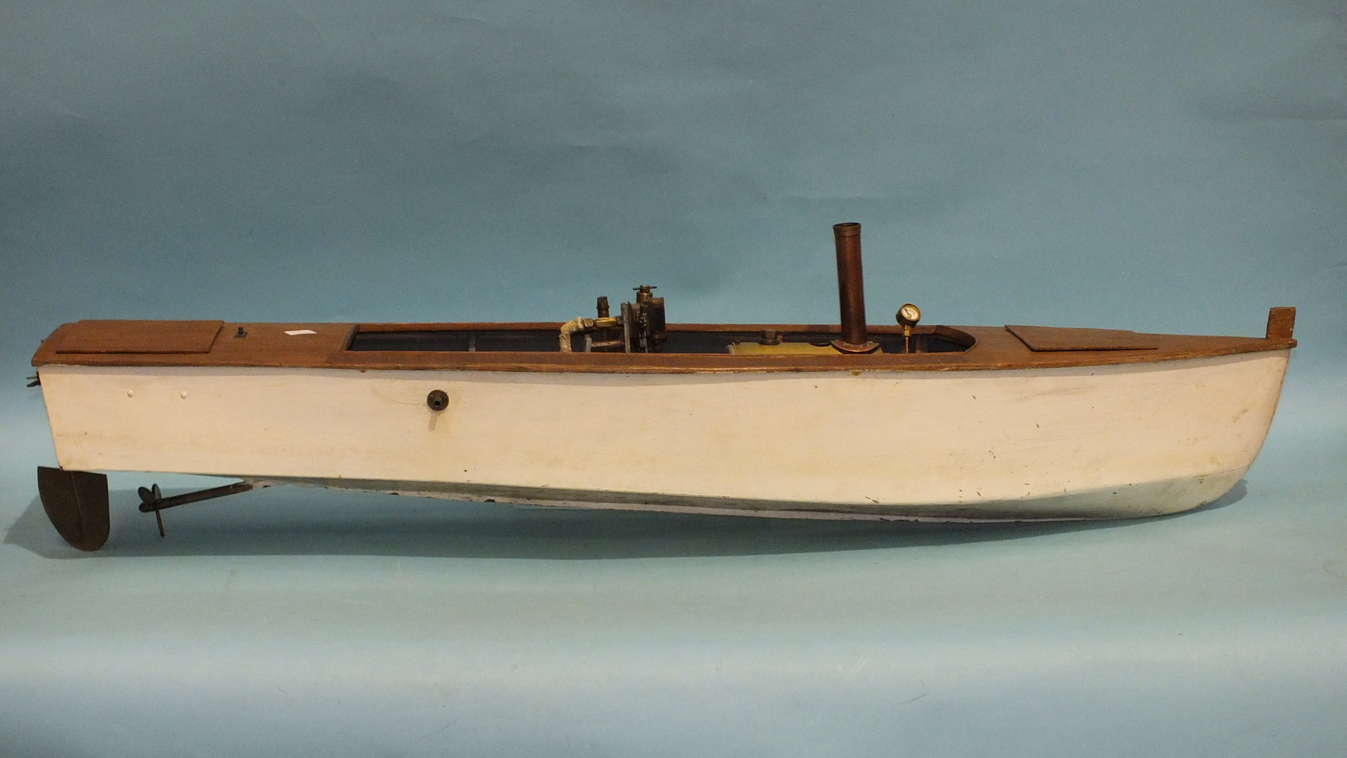 A scratch built live steam model of a boat, of wooden construction, 109cm long, (a/f).