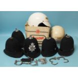 Two pair of Hiatt handcuffs, one with key, five traditional police helmets, two Everoak Police