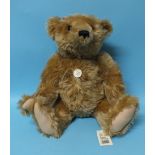 Steiff, a 1903 Classic replica teddy bear with button to ear and tags attached, 50cm.