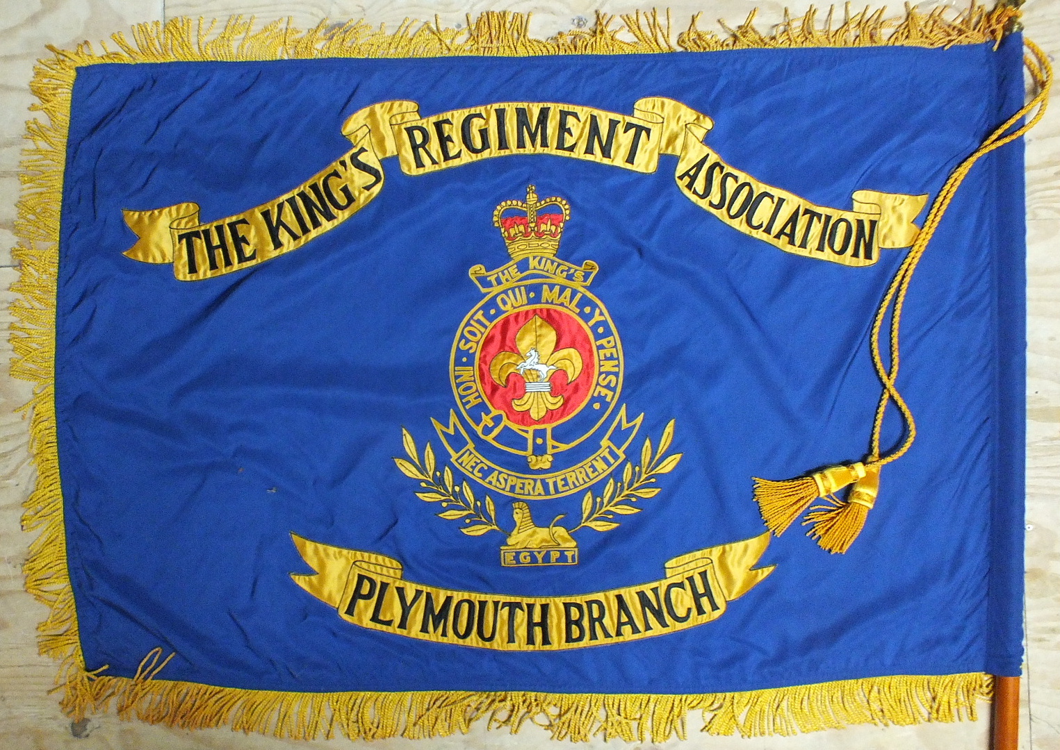 A "The King's Regiment, Plymouth Association" flag, 90 x 128cm, fringed, on pole, with case.