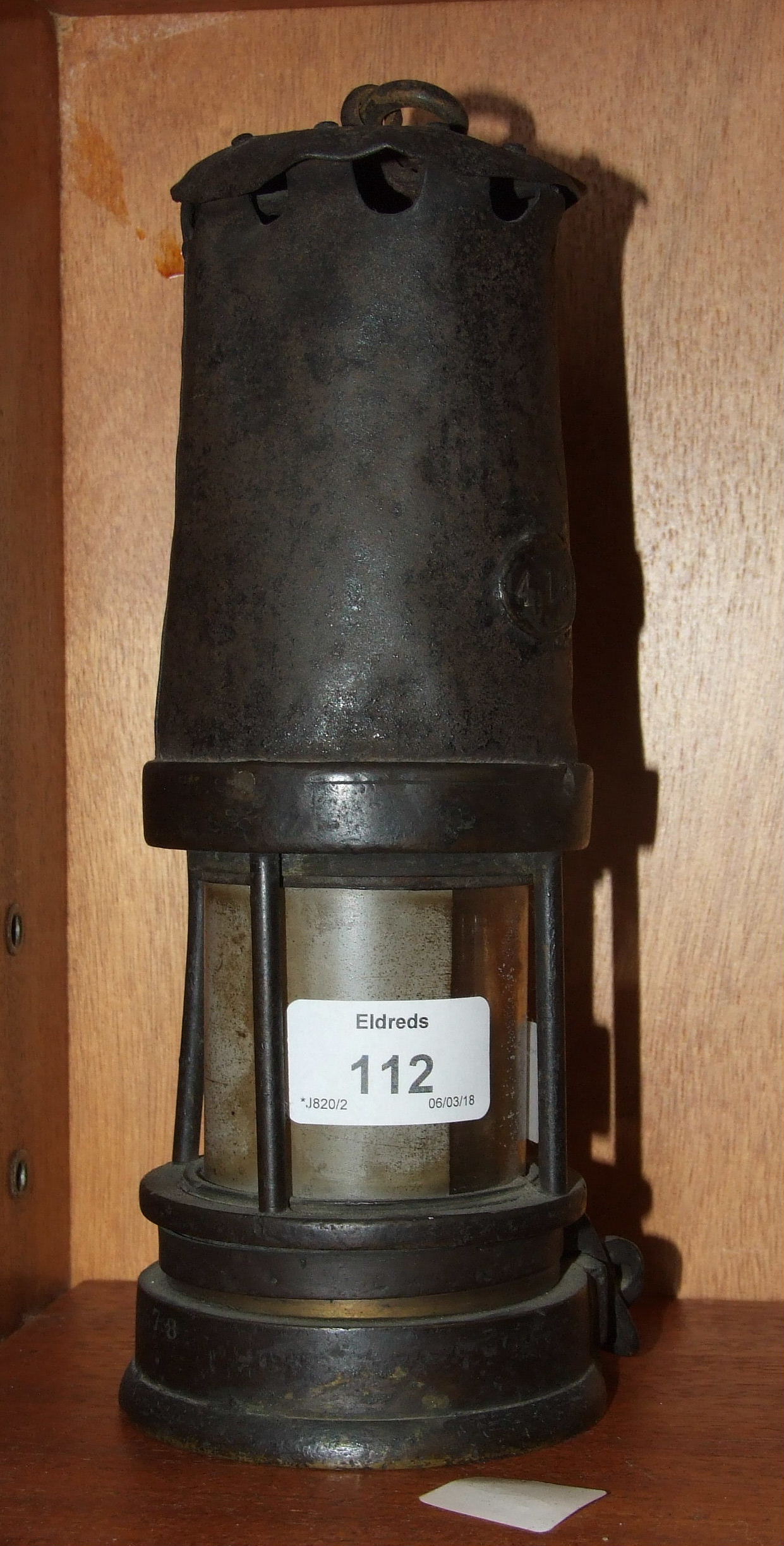 A bronze and iron miners lamp, numbered 416, 23cm high.