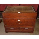 A small hardwood chest, the rectangular hinged lid above two small and one long drawers, 65cm