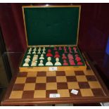 An early 20th century Staunton style ivory chess set in later box, with board.