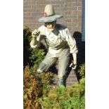 A life-size moulded composite figure of an American farmer wearing a straw hat, dungarees and