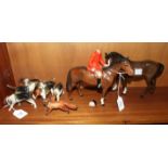 A Beswick model, Huntsman, style two, standing brown horse, af, head off huntsman, six beagles, (5