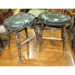 A pair of late 19th/early 20th century stained beech oval seated stools with ring-turned legs,