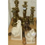 Various brass candlesticks, a ceramic elephant bookend and other items.