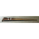 An E J Riley wooden billiards cue and another in japanned metal case, (2).
