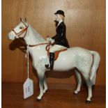 A Beswick model, Huntswoman, style two, rider and horse stood still, grey horse, 21cm high.