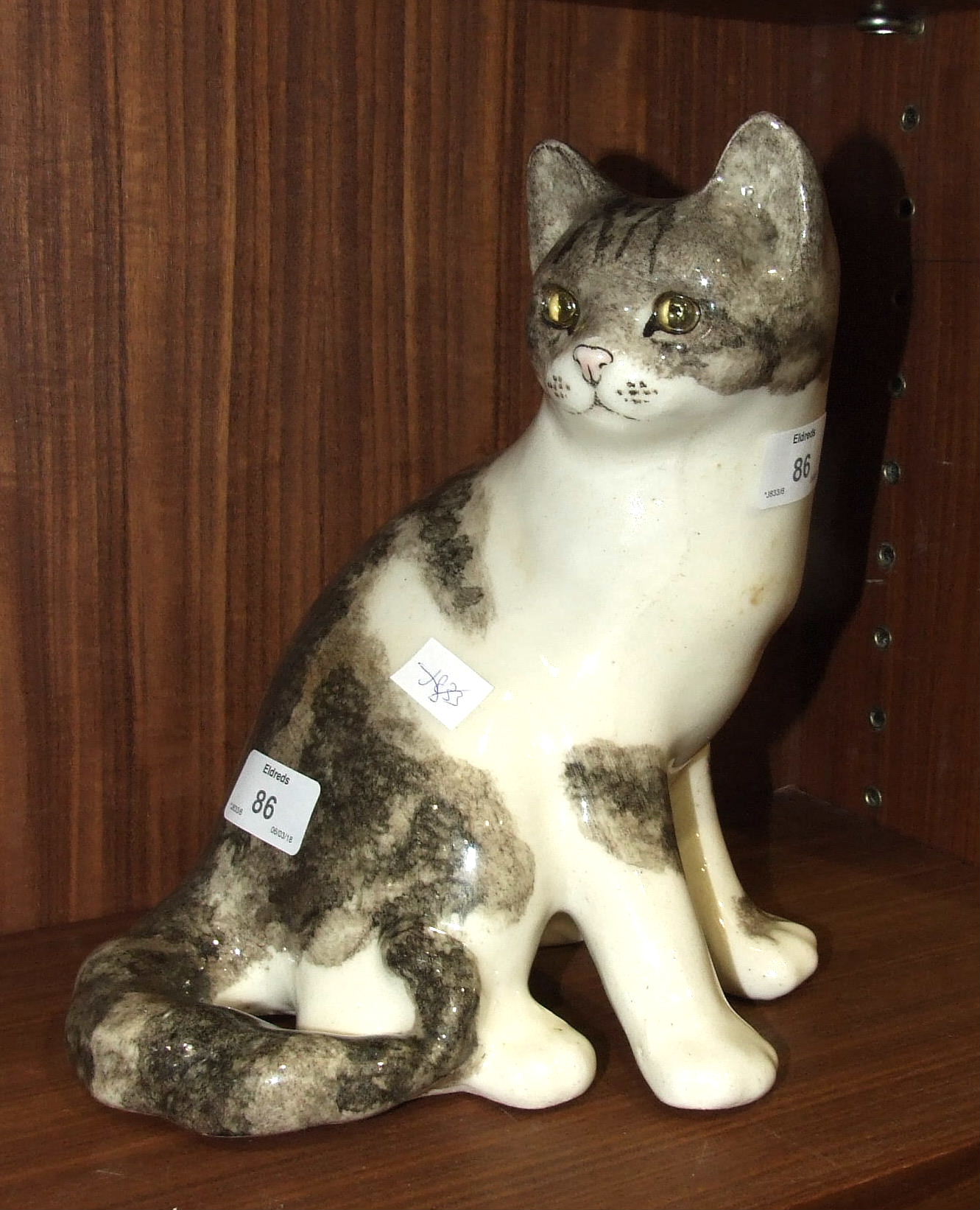 A Winstanley ceramic seated cat, no.5, 25cm high.