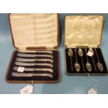 A set of six silver seal top teaspoons in fitted box, Sheffield 1928 and a set of silver pistol
