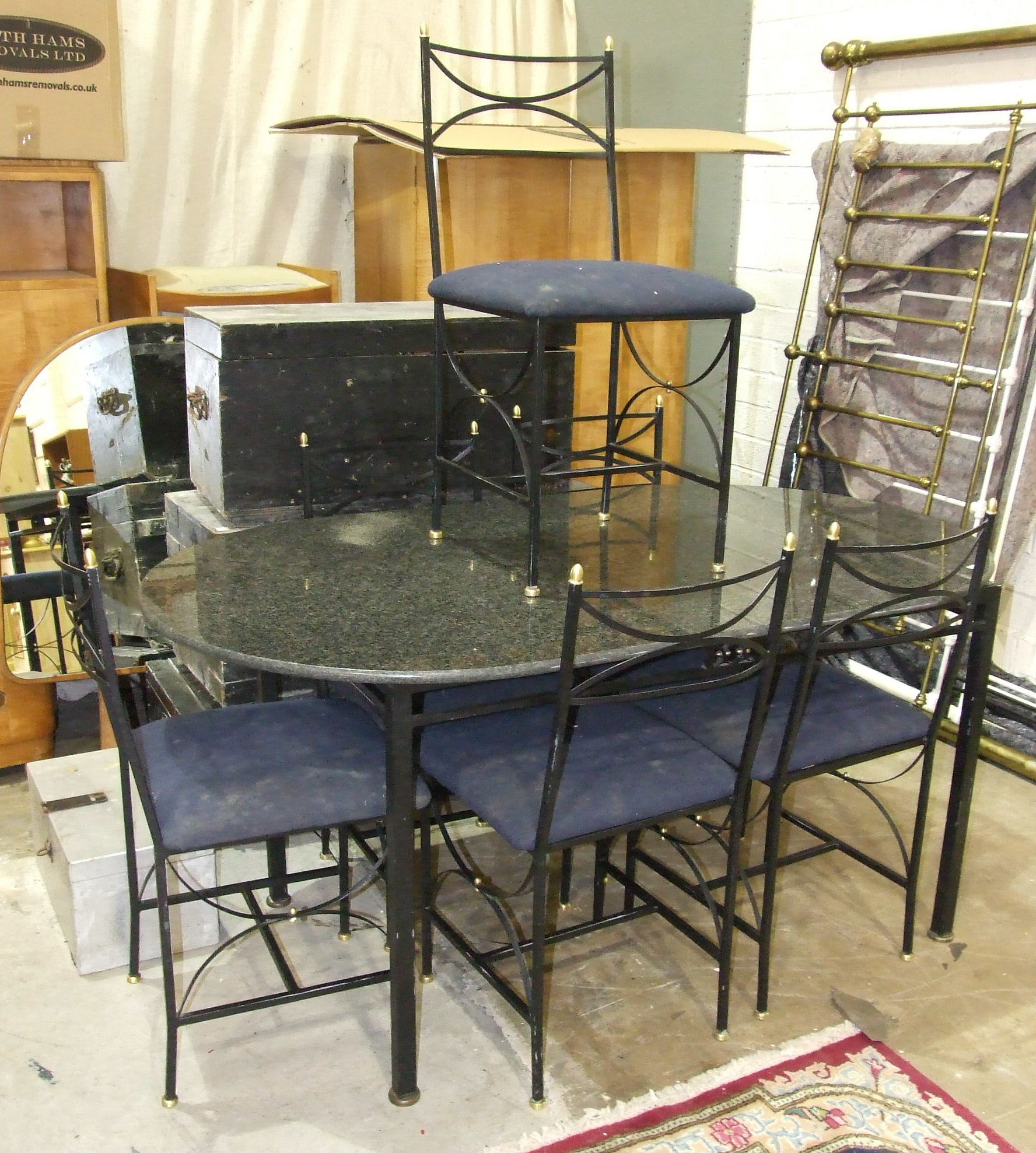 A modern oval marble top table on metal stand, 159 x 89cm and six matching chairs with upholstered