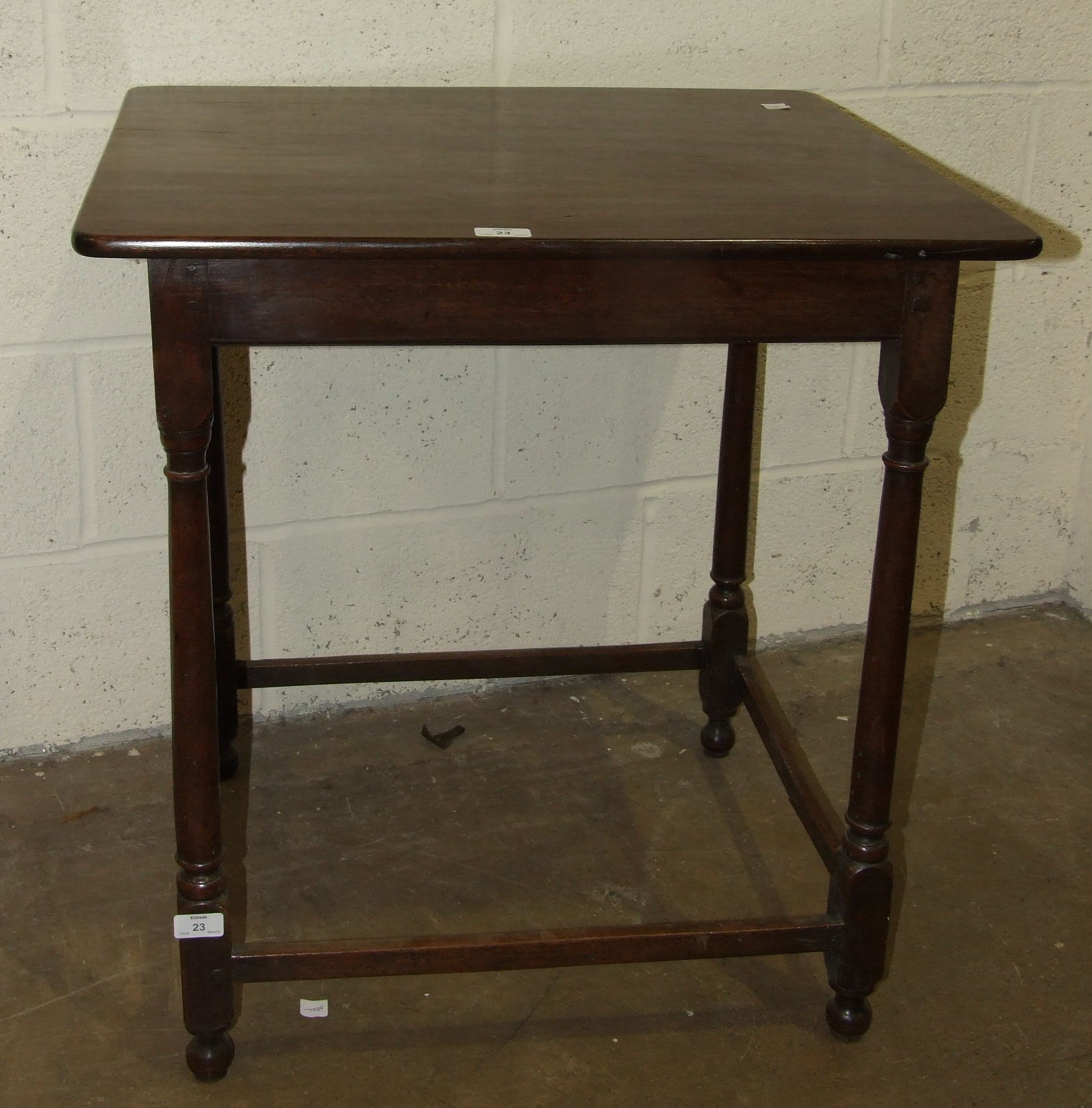 A mahogany occasional table on turned legs united by stretchers, 67 x 59cm, 72cm high.