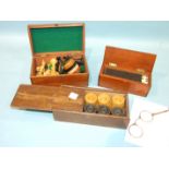 A set of boxwood and ebony draughts, a Staunton style chess set, a set of bone and ebony dominoes
