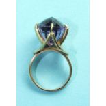An amethyst dress ring, the multi-faceted oval amethyst of approximately 14 carats, claw-set on